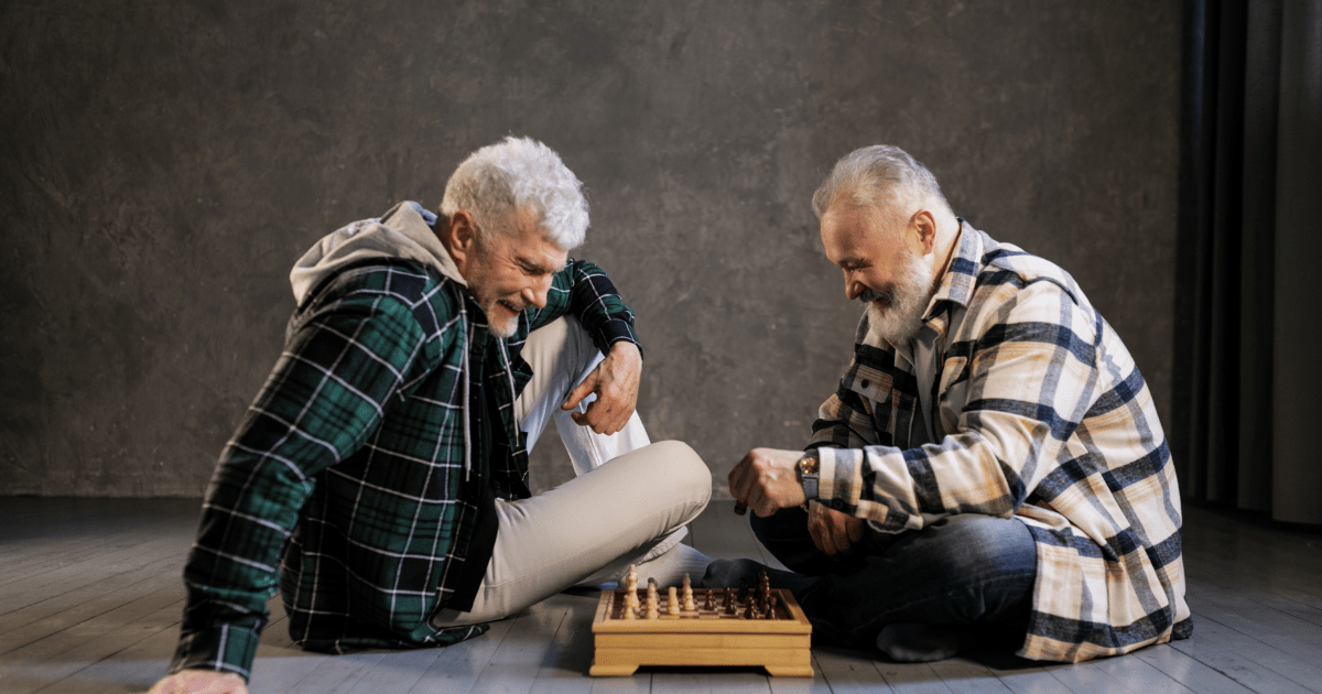 senior men playing chess