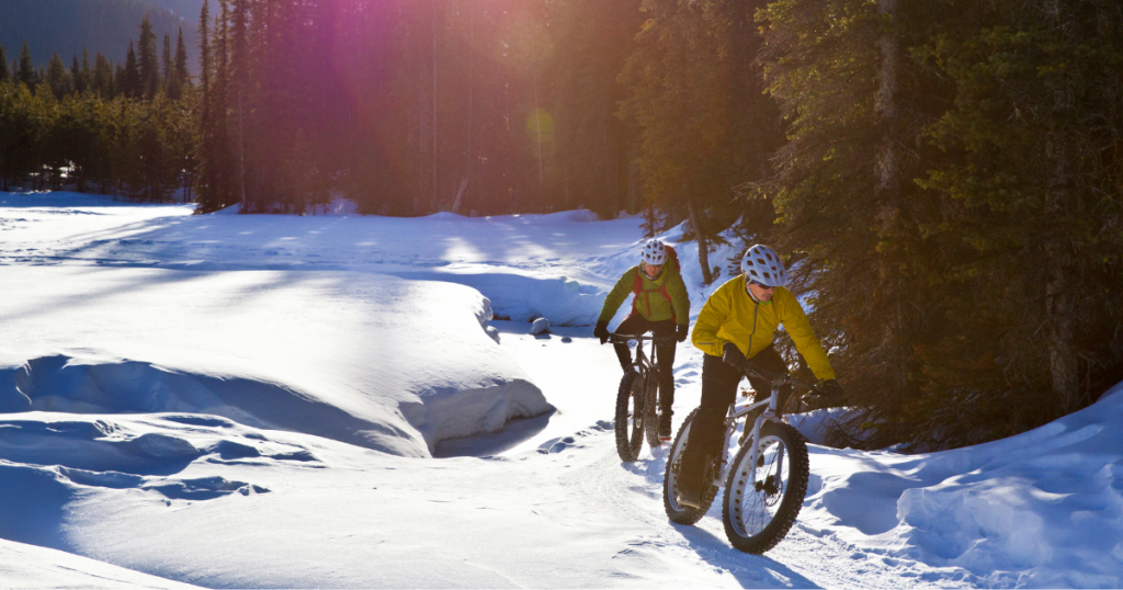 man and woman cycling for physical activity