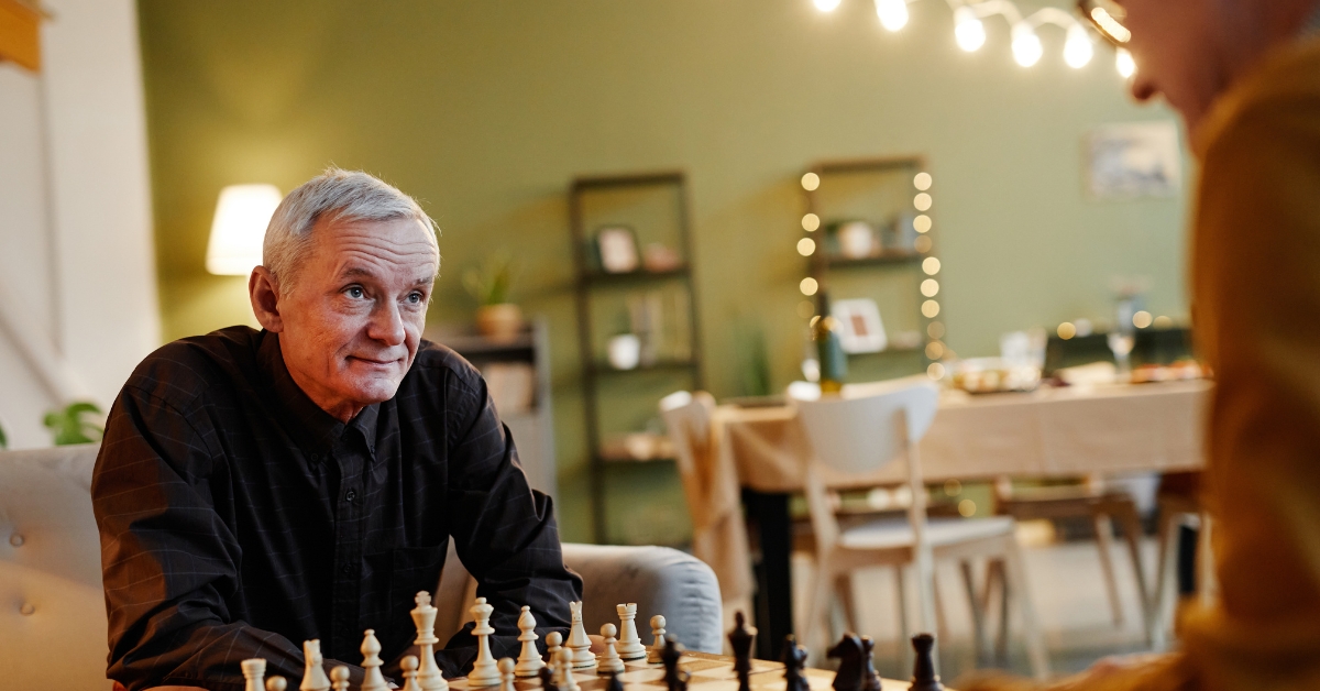 elderly man playing chess