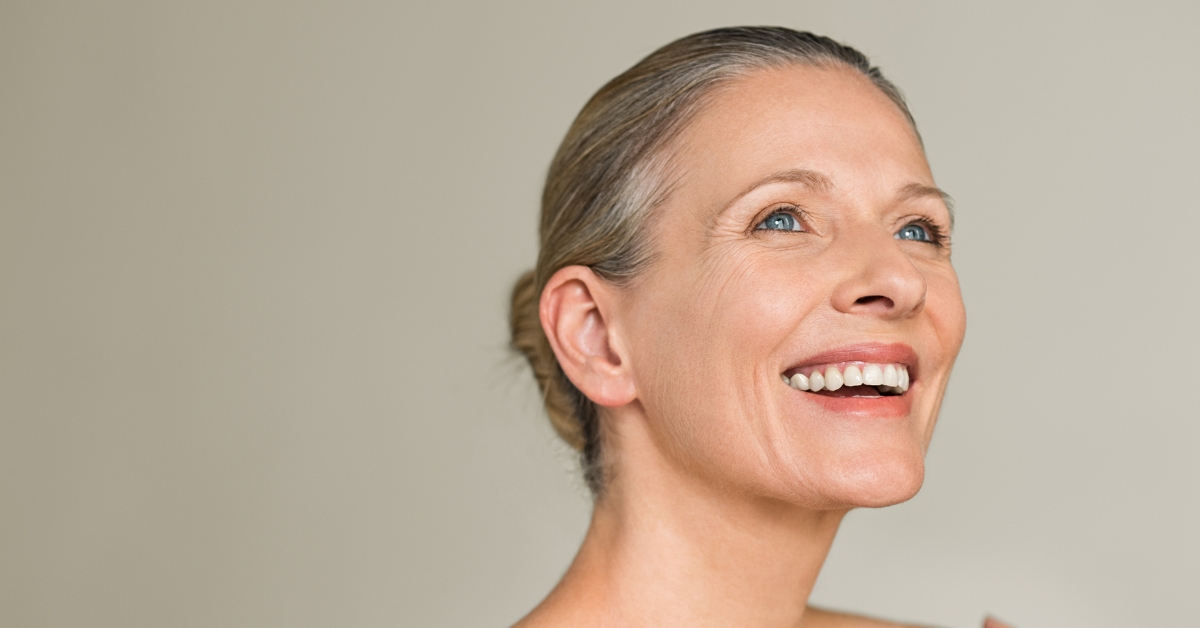 smiling lady looking above, with positive attitude
