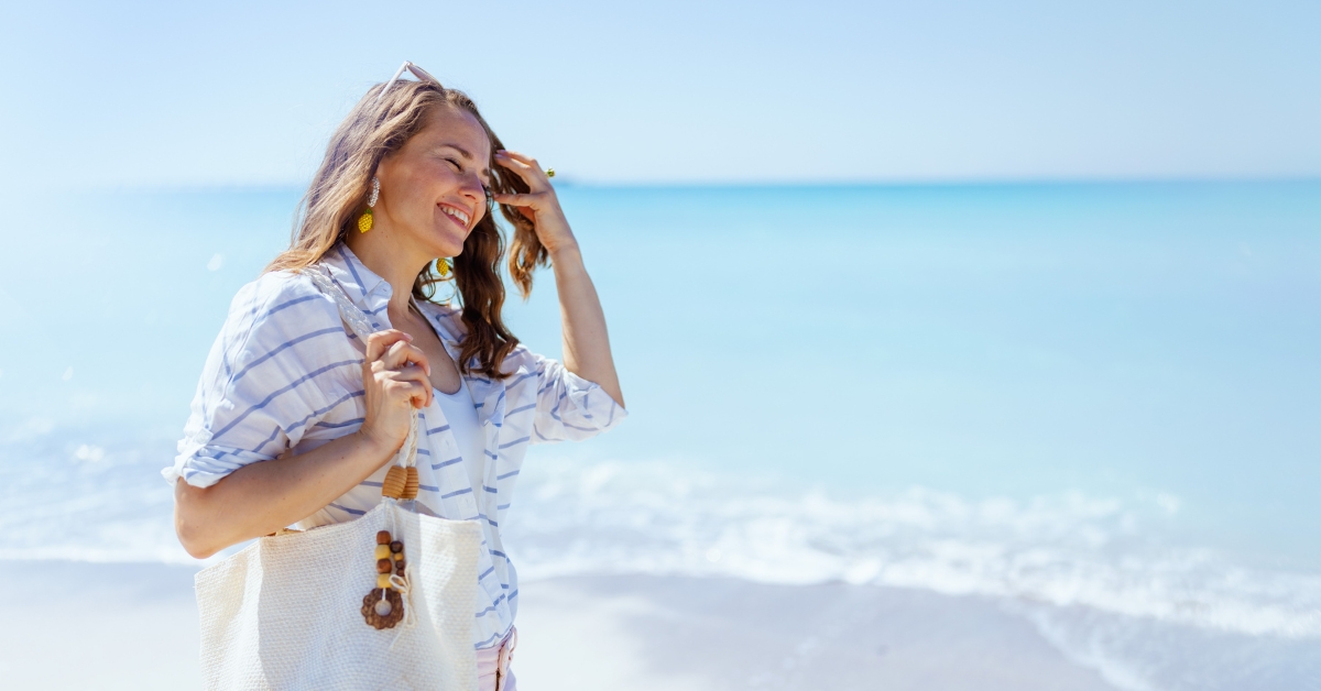 lady mid-age walking by the seashore