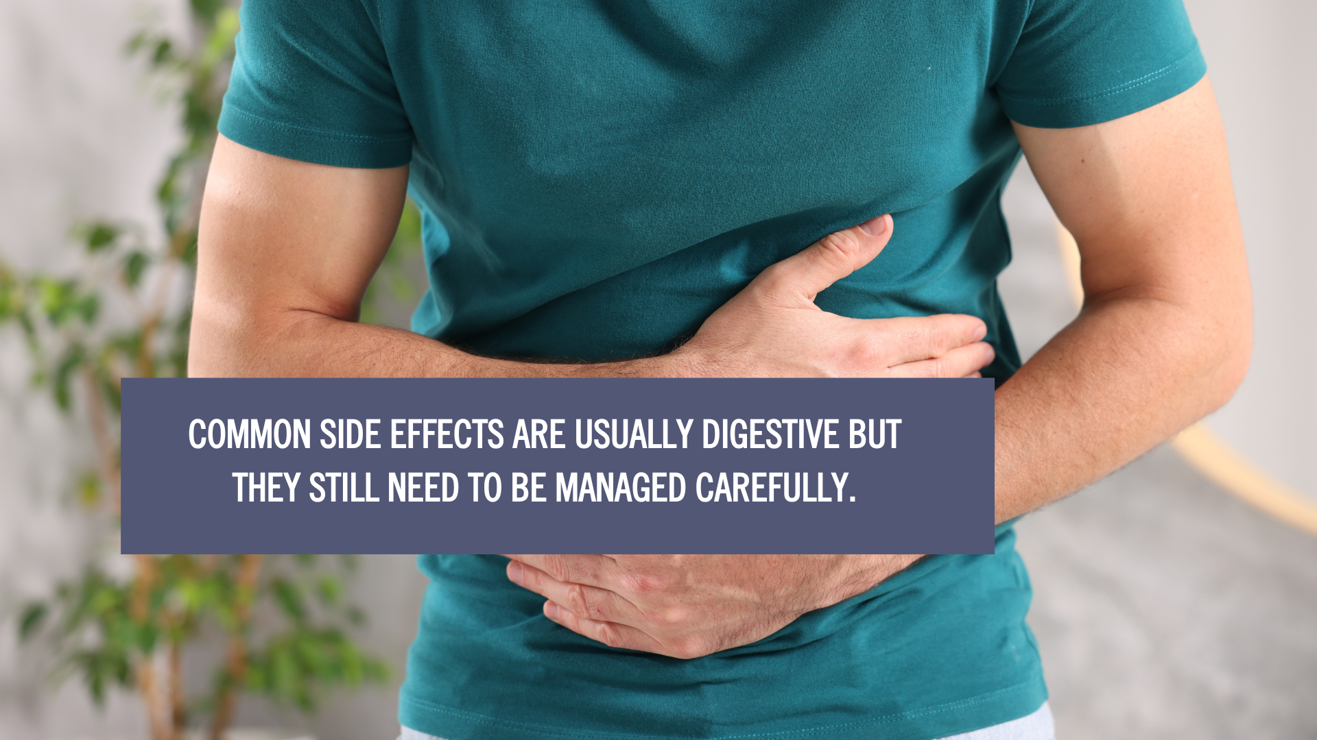 Person holding their stomach in discomfort, illustrating common digestive side effects of weight loss injections that need careful management.