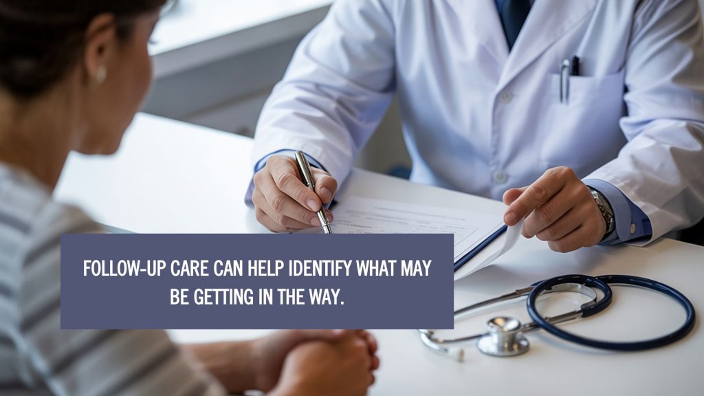 Doctor consulting with a patient in a clinic, discussing follow-up care and treatment progress, with overlay text: Follow-up care can help identify what may be getting in the way.