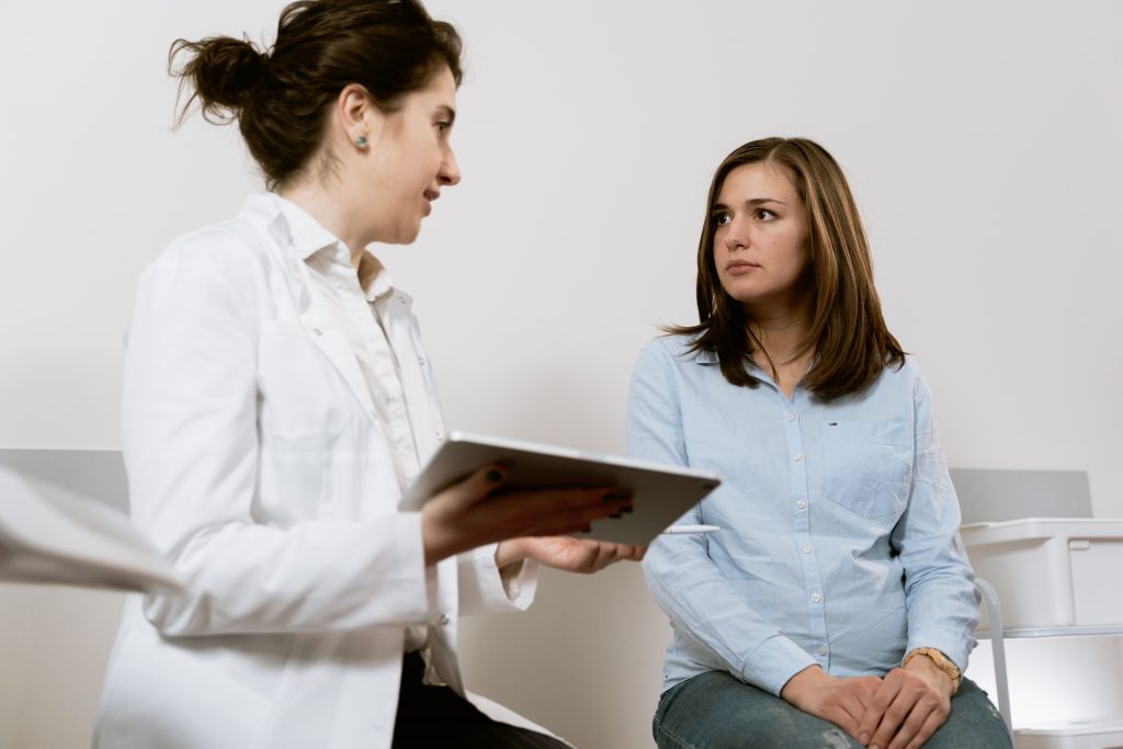 Healthcare provider reviewing hormone imbalance testing results with a patient at KC Medical and Wellness Center