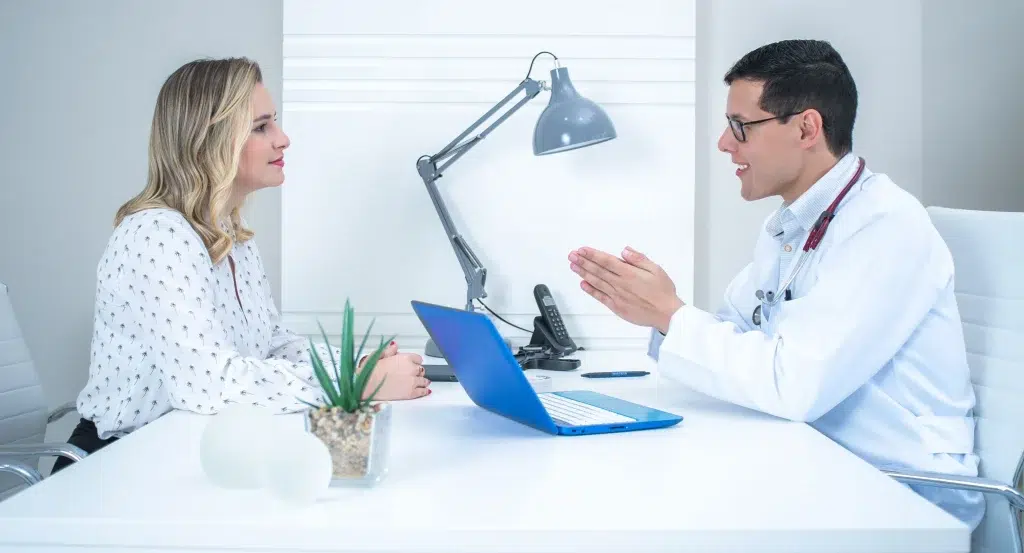 Patient discussing symptoms and health history during a hormone therapy consultation
